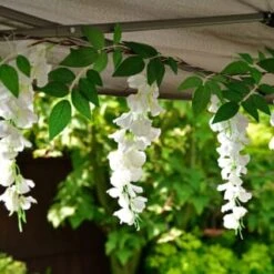 Solar Powered 180cm Artificial Leaf Garland With Wisteria Flowers - Warm White 7 Solar Powered 180cm Artificial Leaf Garland With Wisteria Flowers - Warm White -Garden Supply Store 379258 180cm solar powered artificial leaf garland with wisteria flowers 20 warm white micro leds